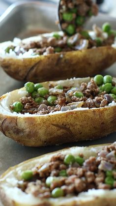 baked potatoes with ground beef and peas on top