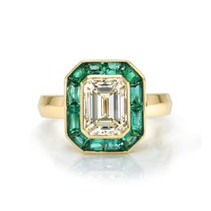 2.00ct M/VVS1 GIA certified emerald cut diamond with 1.05ctw French cut green emeralds bezel set in a handcrafted 18K yellow gold mounting. Luxury Green Emerald Ring With Bezel Setting, Luxury Octagon Emerald Ring With Bezel Setting, Emerald Cut Emerald Ring With Bezel Setting, Luxury Emerald Cut Emerald Ring With Bezel Setting, Luxury Emerald Cut Ring With Bezel Setting, Bezel Set Baguette Cut Emerald Ring, Emerald Baguette Cut Ring With Bezel Setting, Baguette Cut Emerald Ring With Bezel Setting, Baguette Cut Bezel Set Emerald Ring