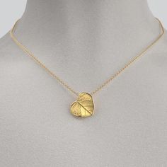 Capture nature's beauty with our dainty Italian 14k or 18k gold heart pendant and chain. Exquisitely small and adorned with a delicate leaf motif, this pendant is a wearable piece of art that symbolizes love and connection. Meticulously crafted in Italy, the intricate details and fine craftsmanship make this tiny heart pendant a cherished expression of elegance and nature's grace. 14k or 18k gold 16mm high 15mm large 18k Rolò chain chain length 45cm chain thickness 1.5mm designed and crafted in 14k Yellow Gold Leaf-shaped Jewelry, Delicate Yellow Gold Sterling Silver Heart Necklace, Yellow Gold Leaf-shaped Jewelry Gift, Yellow Gold Leaf-shaped Jewelry For Anniversary, Yellow Gold Leaf-shaped Anniversary Jewelry, Anniversary Yellow Gold Leaf Jewelry, Leaf-shaped Yellow Gold Plated Jewelry, Yellow Gold Plated Leaf-shaped Jewelry, Leaf-shaped Yellow Gold Necklace For Gift