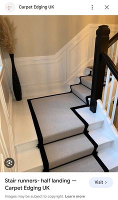 a stair runner with black trim on the bottom and white handrails, along with carpet edging