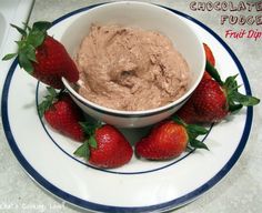 chocolate fudge fruit dip in a bowl with strawberries