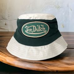 Von Dutch Bucket Hat Cream Green Little Kids Pattern: Colorblock Character: N/A Occasion: Casual Size: One Size Color: Cream & Dark Green Fabric Type: Canvas Accents: Embroidered Vintage: No Brand: Von Dutch Personalize: No Department: Unisex Kids Style: Bucket Hat Theme: Modern Features: Breathable Season: Spring Summer Character Family: N/A Handmade: No Circumference 21” Summer Character, Brown Bucket Hat, Yellow Bucket Hat, Toddler Bucket Hat, Dark Green Fabric, Pink Trucker Hat, Blue Bucket Hat, Style Bucket Hat, Hat Cream