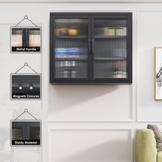 a wall mounted cabinet next to a green chair in a room with white walls and pictures on the wall