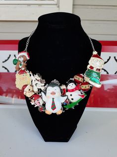 "My Mom and I made this statement necklace using broken jewelry pieces!  Holiday Christmas Necklace for that Christmas Fanatic!  It's a fun piece to wear and be totally into the spirit of the Holidays!  Repurposed statement bib necklace with silver tone metal chain.  **If you live outside the USA message me and I'll give you a shipping quote.** *Look us up on Facebook at:  \"Sparkle my Glitter\" to see all of our creations." Handmade Jewelry For Christmas Celebration, Novelty Christmas Jewelry For The Holidays, Novelty Christmas Holiday Jewelry, Christmas Novelty Silver Jewelry, Christmas Holiday Novelty Jewelry, Themed Handmade Multicolor Necklace, Themed Multicolor Necklace For Gift, Vintage Christmas Gift Necklaces, Vintage Necklaces For Christmas Gifts