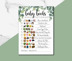 the baby book emolltionary printable is shown on a marble background with green leaves