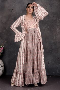 Buy stunning beige printed maxi dress online in USA with shrug. Set a fashion statement at parties in designer Indian suits, Anarkali suits, designer lehengas, gowns, Indowestern dresses from Pure Elegance Indian fashion store in USA.-full view Festive Maxi Dress With Cape Sleeves, Cream Fitted Floor-length Sets, Beige Floor-length Dress For Spring, Full Length Beige Dress For Spring, Beige Full Length Dress For Spring, Beige Fitted Bohemian Sets, Beige Full-length Dress For Spring, Long Cream Festive Dress, Cream Anarkali Floor-length Dress