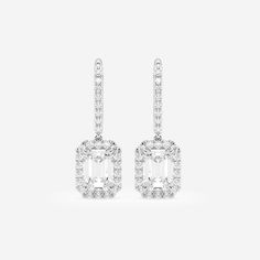 Let these emerald cut diamond earrings drop from your ears and scream out style. Each lab grown emerald shaped diamond is surrounded by round stones to create a halo effect. Beautiful diamond set lever backs are easy to slip on and sit securely on your ears. We suggest wearing these at a cocktail party, wedding dinner or even a summer soiree. Emerald Cut Diamond Earrings, Summer Soiree, Emerald Cut Diamond, Wedding Dinner, Earrings Drop, Diamond Set, Emerald Cut Diamonds, Diamond Drop Earrings, Diamond Halo