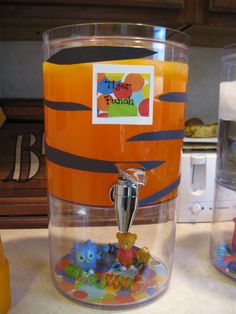 an orange and black container filled with gummy bears