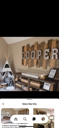 an image of a room with wooden letters on the wall and pictures hanging above it