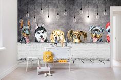 four dogs are hanging on the wall next to a table