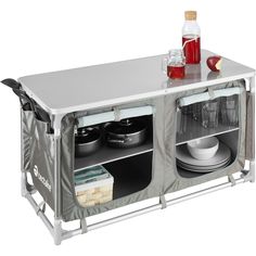 an outdoor table with two compartments for food and drinks