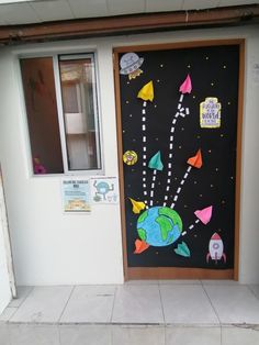 a door decorated with space shuttles and rockets