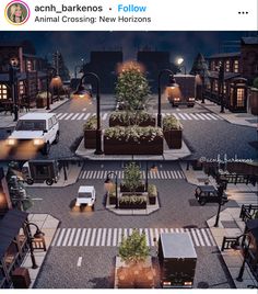 an aerial view of a city at night with cars parked on the street and trees growing in planters