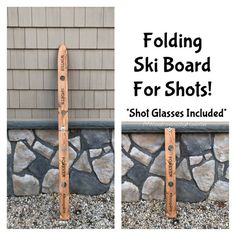 two wooden skis sitting on top of a stone wall next to a building with the words folding ski board for shots