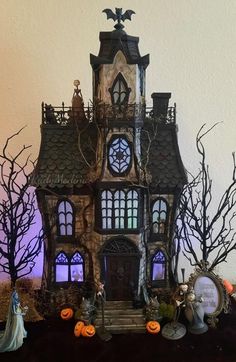 an elaborate halloween house with pumpkins and decorations