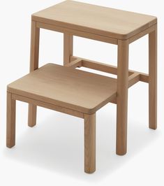 two wooden stools sitting next to each other on a white background with no one around them