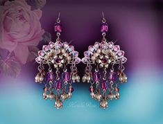 "This pair of Handmade Chandelier Earrings is made with vintage Swarovski Amethyst hand-set jewels, glass pearls and crystal beads.   Aurora crystal rhinestones add a fan- shaped sparkle!  Pierced with french wires (as shown), leverbacks, clip-ons or posts, just select from the pull-down menu.  The video is taken in Bright California sunshine, these are bronze plated metals, not gold.   -2 1/2\" Long (excluding piercing) x 1\" Wide -0.1 oz. ea. Choose from: -White Pearls -Cream Pearls *These can Purple Bohemian Chandelier Earrings For Party, Bohemian Purple Chandelier Earrings For Party, Bohemian Purple Earrings For Wedding, Victorian Chandelier, Handmade Chandelier, Jewelry Purple, Pearl Cream, French Wire, Chandelier Earrings