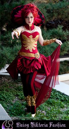 a woman in a red and gold costume is walking down the street with her hands on her hips