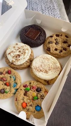 a box filled with lots of different flavored cookies