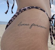 “divine feminine” tattoo in black color. this tattoo located on the buttock. it is look so amazing i advice to do such tattoo Baddie Quotes Tattoo, Mac Miller Nails Ideas, Love Inspired Tattoos, Handle With Care Tattoo, French Tattoo Ideas, Mac Miller Aesthetic, Pure Tattoo, Self Care Tattoo