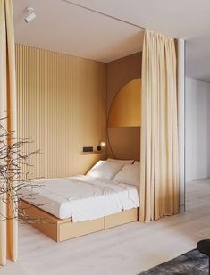 a bed sitting in the middle of a bedroom next to a tall wooden headboard