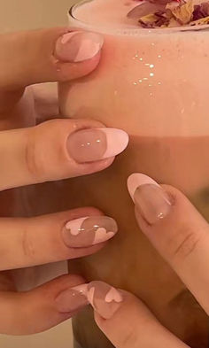 cute heart nails: pink French tips with hearts Almond Shaped Nails Aesthetic, Nail Inspo Almond Pink And White, Heart And Sparkle Nails, Cute Oval Shaped Nails, Soft Pink Acrylic Nails Coffin, Trendy Gel Nails 2023, Nail Inspiration Coquette, Cuqoutte Nails, Almond Nails Kpop