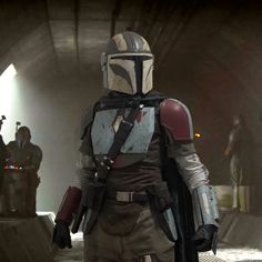 boba fett from star wars standing in a tunnel with other people behind him