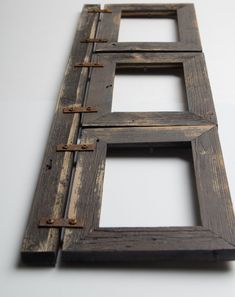 an old wooden ladder with two windows on the bottom and one in the middle that is missing