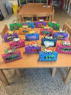 the table has many bags on it for children to put in their own purses