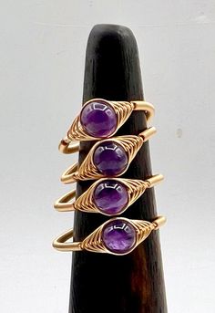 Natural Amethyst Rings Gemstone Rings, Crystal Rings, Wire Wrapped Rings, Healing Custom Rings, Dainty Natural Stone Rings, Handmade Rings, Birthstone Gift, silver gold wire wrap, Silver Plate or Gold Plated, Ring Adjustable   Bead Approximate Size: 6mm  For more Listing on ring click here: https://www.etsy.com/shop/YoungGemStone?ref=profile_header&search_query=ring For all other Store products, click here: https://www.etsy.com/shop/YoungGemStone?ref=profile_header Ring care instructions:  Do no Wire Wrapped Crystal Ring For Anniversary, Stackable Amethyst Rings, Adjustable Purple Ring, Adjustable Amethyst Stackable Rings, Wire Wrapped Round Ring For Promise, Amethyst Stackable Rings, Adjustable Stackable Amethyst Rings, Rings Birthstone, Amethyst Rings