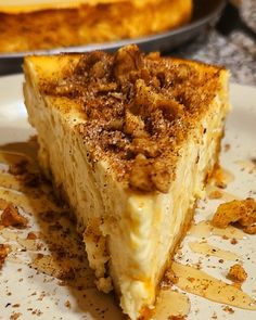 a piece of cake sitting on top of a white plate next to a pie pan