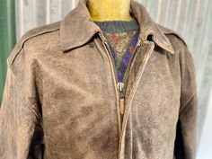 You can't go wrong with a classic leather bomber jacket. This 1990's Adler jacket is designed to look like a traditional war-era aviator jacket. It is made from a heavy but soft leather in brown with a deliberate distressed finish. It has a zip closure, turn down collar, two front patch pockets with flap closure and two hand-warmer pockets.  Size L Measurements: Chest: 126 cm / 50 inches Shoulder: 61 cm / 24 inches Length: 71 cm / 28 inches Sleeve: 63 cm / 25 inches     This item is one of a kind.     BUYING VINTAGE: While all care is taken to state any obvious faults, please note that when you buy a vintage or preloved item, they may show small signs of ageing, wear and/or repair. Visit my new website   https://phoenixmenswear.com.au/ Lots of fun stuff for guys and girls...!! Please note Vintage Outerwear With Ykk Zipper For Fall, Vintage Aviator Leather Outerwear, Vintage Leather Aviator Outerwear, Fall Aviator Leather Jacket For Outdoors, Fall Outdoor Aviator Leather Jacket, Retro Leather Jacket For Outdoor, Retro Outdoor Leather Jacket, Aviator Jacket, Aviator Jackets