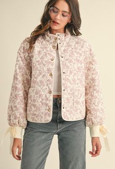 The Elanor Jacket features a quilted material, floral fabric, ribbon bow detail, and button up front! Model is a 2/4 wearing a Small! Rose Quilt, Quilted Pattern, Long Balloons, Fabric Ribbon, Ribbon Tie, Balloon Sleeves, Bow Detail, Blouse Dress, Floral Fabric