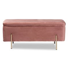 a pink velvet bench with gold legs