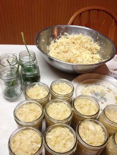 there are many jars with food in them on the table