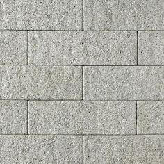 a close up view of a wall made out of concrete blocks with no mortars