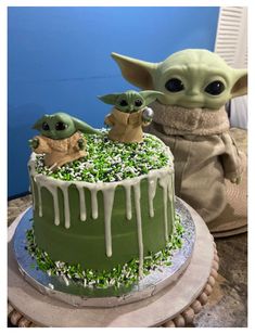 the baby yoda cake is decorated with green icing and sprinkles