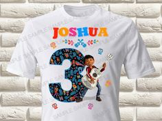 a white t - shirt with the number three printed on it and an image of a boy