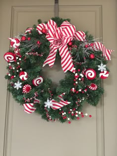 a christmas wreath with candy canes and candies