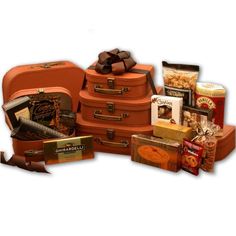 No need to leave the good stuff at home! Send The Traveling Gourmet Tower, a gift basket in 3 faux leather suitcases for a treat on the go! Everyone will love this unique gift that keeps on giving after the goodies are gone. The 3 suitcases will be great for travelers for years to come. Send The Traveling Gourmet Tower today! Includes: 3 pc Faux Leather Suitcases, Three Pepper Crackers, Cocoa Comfort Vanilla Cream Cocoa, Sliced Beef Salami, Honey Sweet Peanuts, Ghirardelli Chocolate Bar, 1.9 oz. Garlic Cheese Spread, Beef Salami, Spiced Pretzels, Deli Platters, Gourmet Sweets, Best Gift Baskets, Gift Towers, Ghirardelli Chocolate, A Gift Basket