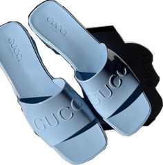 Trendy Blue Slides For Vacation, Luxury Blue Sandals For Summer, Elegant Blue Sandals For Vacation, Luxury Blue Summer Slides, Luxury Blue Slides For Summer, Blue Flat Slides, Gucci Slides For Summer Beach, Designer Blue Slides For Summer, Designer Blue Sandals For Spring