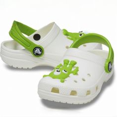 Design: Adorable Alien Design Glow In The Dark Iconic Crocs Comfort With Original Croslite Foam Cushion Heel Strap Keeps Shoe On Foot And Can Be Rolled Forward For A Slip-On Silhouette Anti-Microbial And Odor-Resistant Properties Toe Box Ventilation System For Cooling Comfort Footbed Supports And Comforts Their Feet All Day Long Built-In Arch Support Non-Marking Outsoles Additional Details: Easy To Clean And Quick To Dry; Washes Off With Soap And Water Customizable With Jibbitz Charms Hot Pink Shoes, Lined Crocs, Blue Crocs, White Crocs, Black Crocs, Pink Crocs, Kids Clogs, Crocs Boots, Toddler Sandals Girl