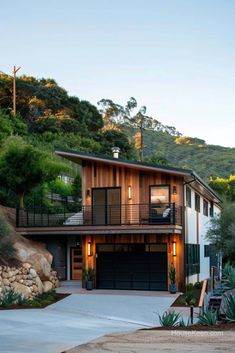 a modern house on the side of a hill