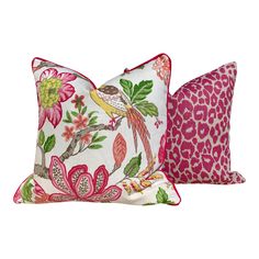 two decorative pillows with pink and green floral designs, one on the left and the other on the right