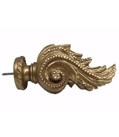 an ornate brass door handle on a white background