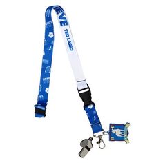 Look like a proper coach with this super cool lanyard keychain inspired by the tv comedy, Ted Lasso! The Ted Lasso Lanyard with Keychain has a strap made of high-quality polyester to ensure superior color quality and durable zinc alloy hardware for added security. The lanyard features original blue and white team artwork on both sides of the strap as well as a keychain. The break-away strap and lower buckle release makes it quick and easy to separate your items when needed. This super fun lanyar Tv Comedy, Ted Lasso, Lanyard Keychain, Comedy Tv, Id Badge, Super Cool, Lanyard, Zinc Alloy, Buckle