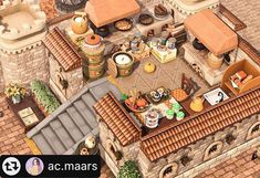 an aerial view of a kitchen and dining area in a castle like building with brick roofing