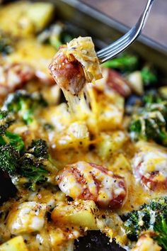 broccoli and chicken casserole being lifted with a fork