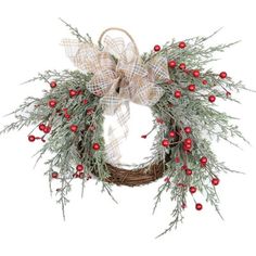 a christmas wreath with red berries and greenery