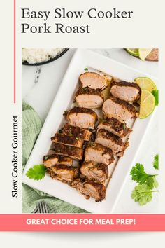 the easy slow cooker pork roast recipe on a white plate with limes and cilantro